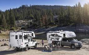 RV campers parked at a river